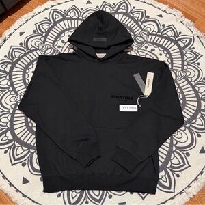 Essentials Black Pullover Hoodie with Minimal Chest Logo